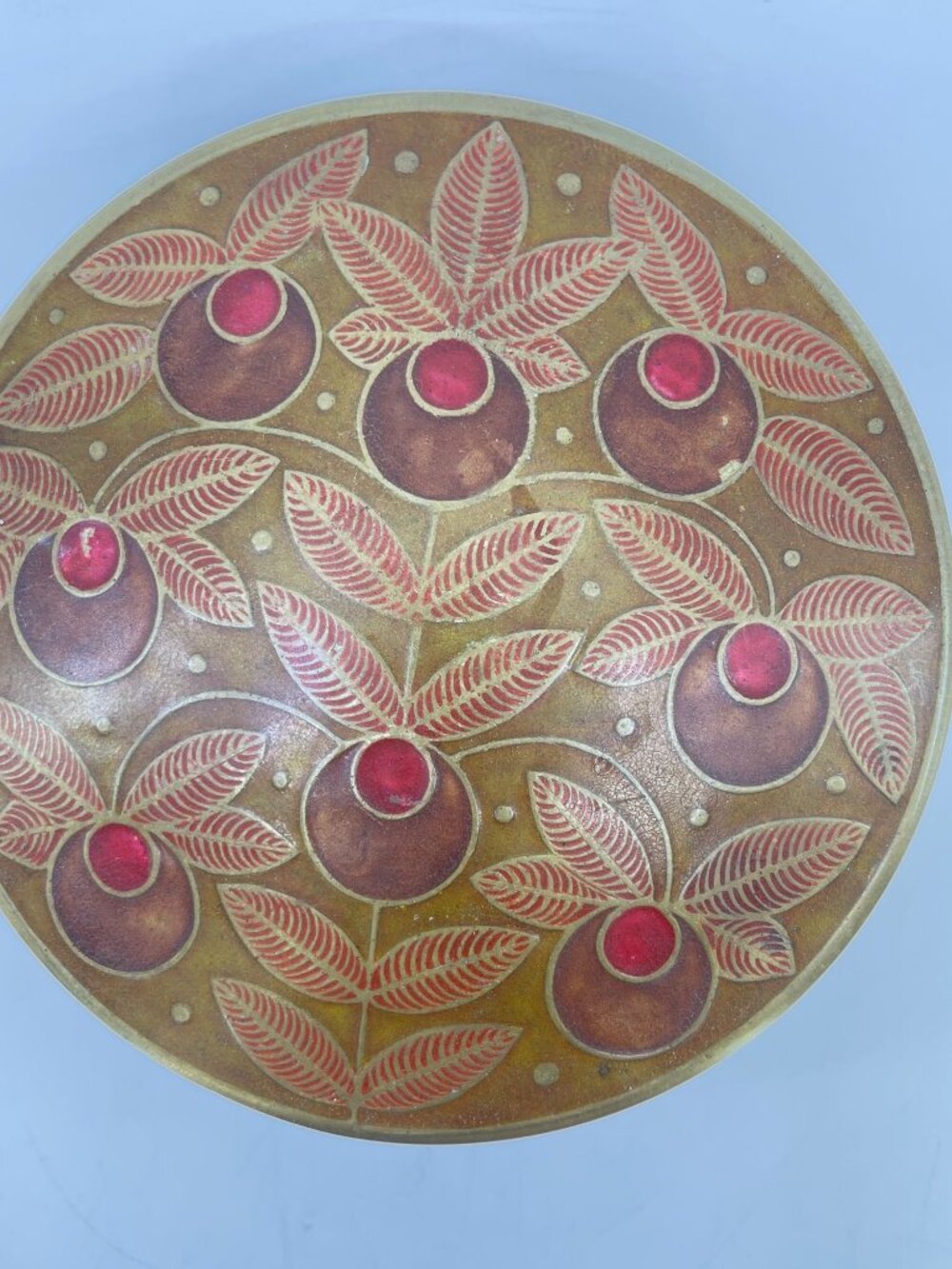 vintage brass trinket box with floral enamel decorative pattern on lid